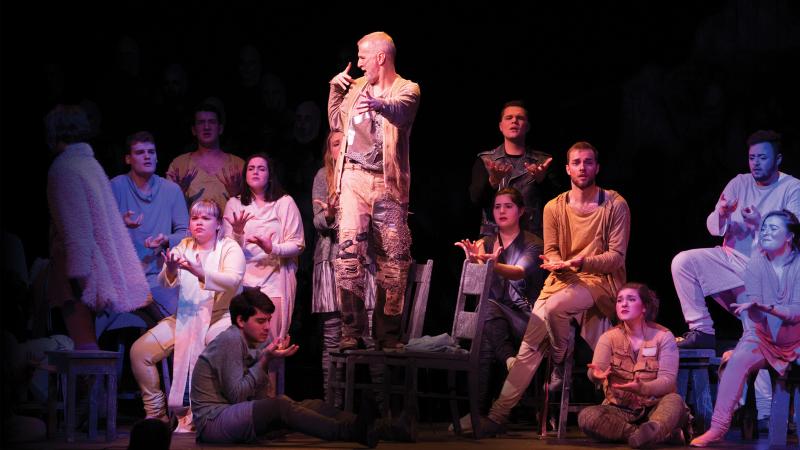 Opera show with Robert Schleifer (standing) and the cast of Mass. using sign language. Part of the innovative programming theatre majors engage in at Lawrence.