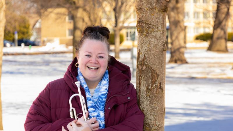 Nadje Noordhuis poses with her trumpet on Main Hall Green.
