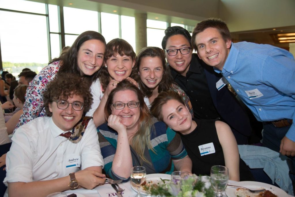 seven students 和 their professor get together to take a picture