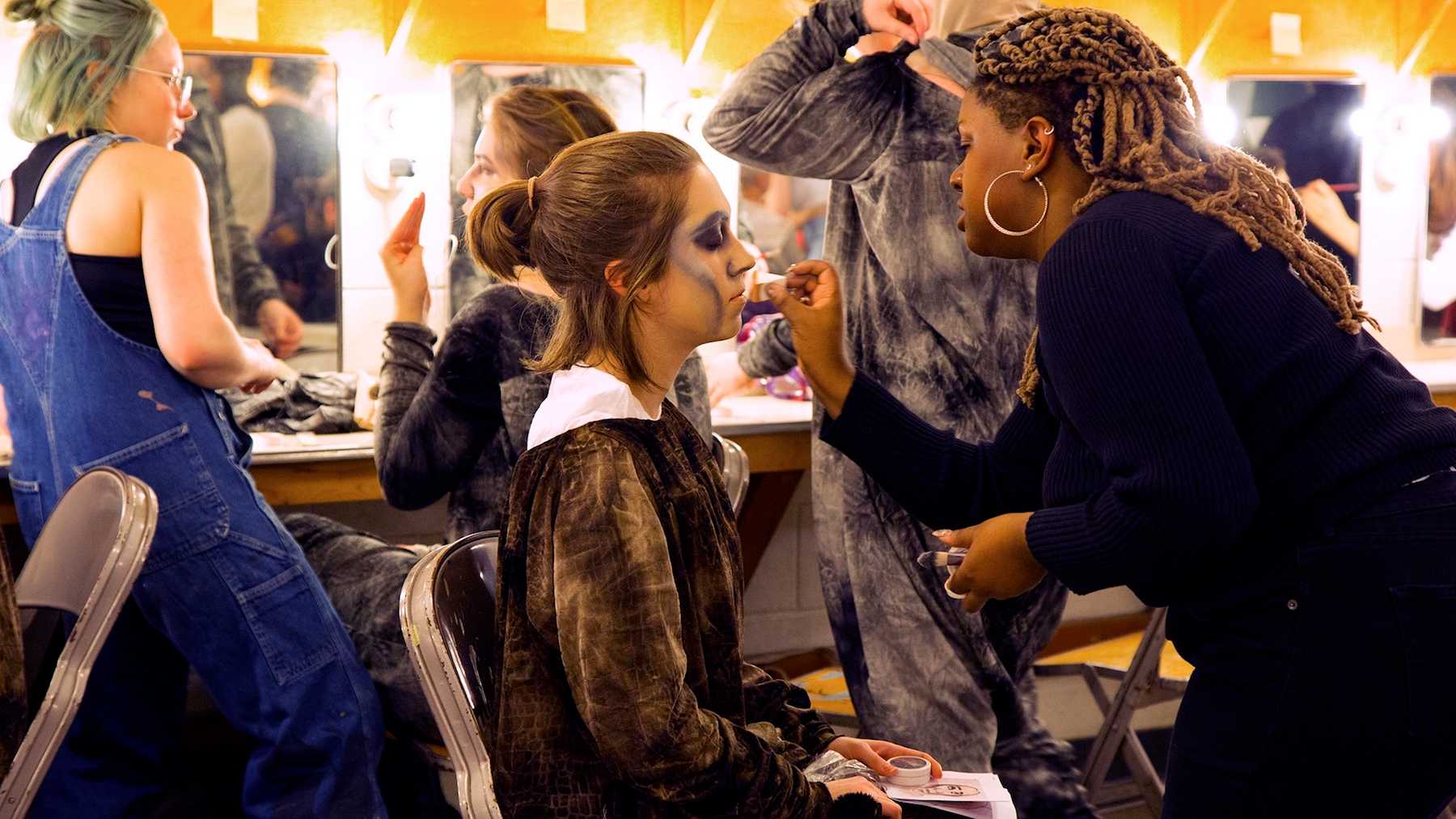 Makeup and costume work is done in advance of a dress rehearsal for "质量。"