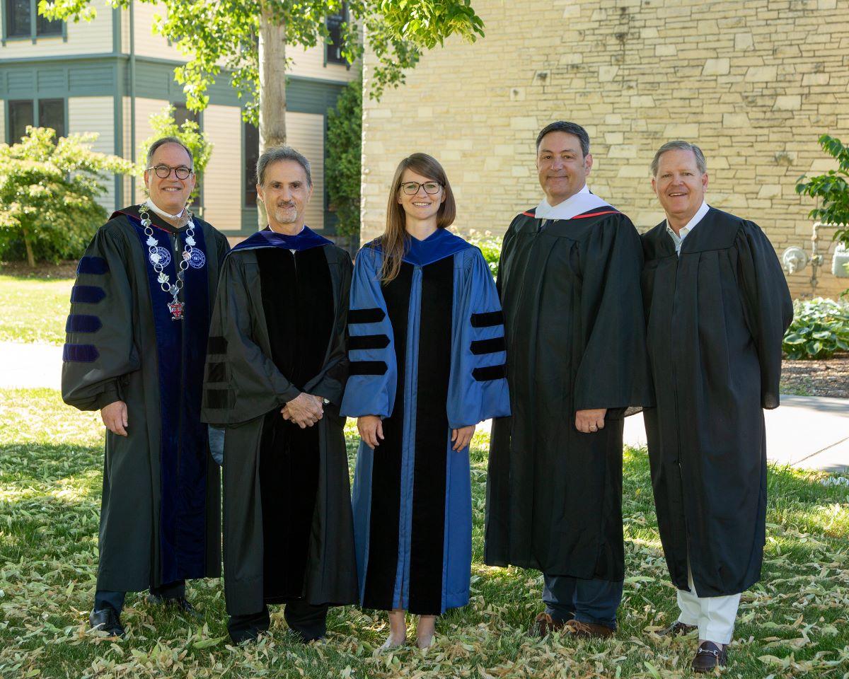 Mark Burstein, three faculty, and the Board of Trustee chair in gowns 
