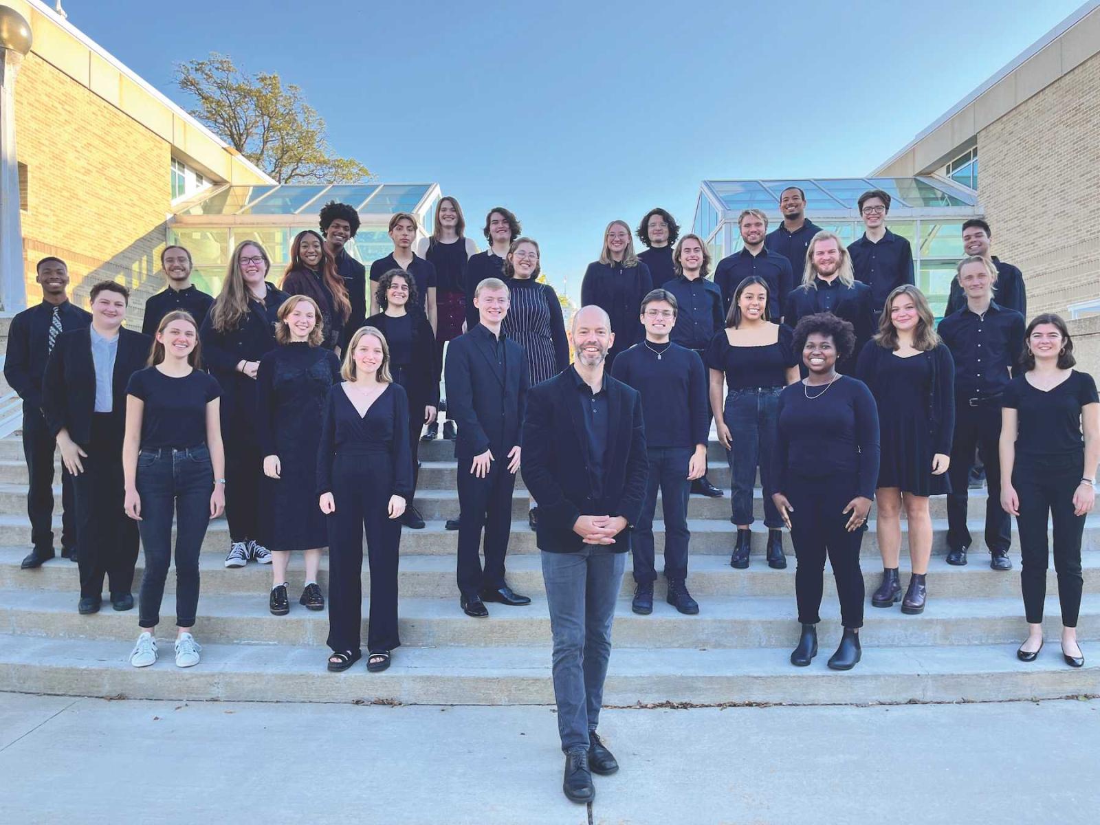 The Lawrence University Concert Choir poses for a photo on the steps near the Music-Drama Center.