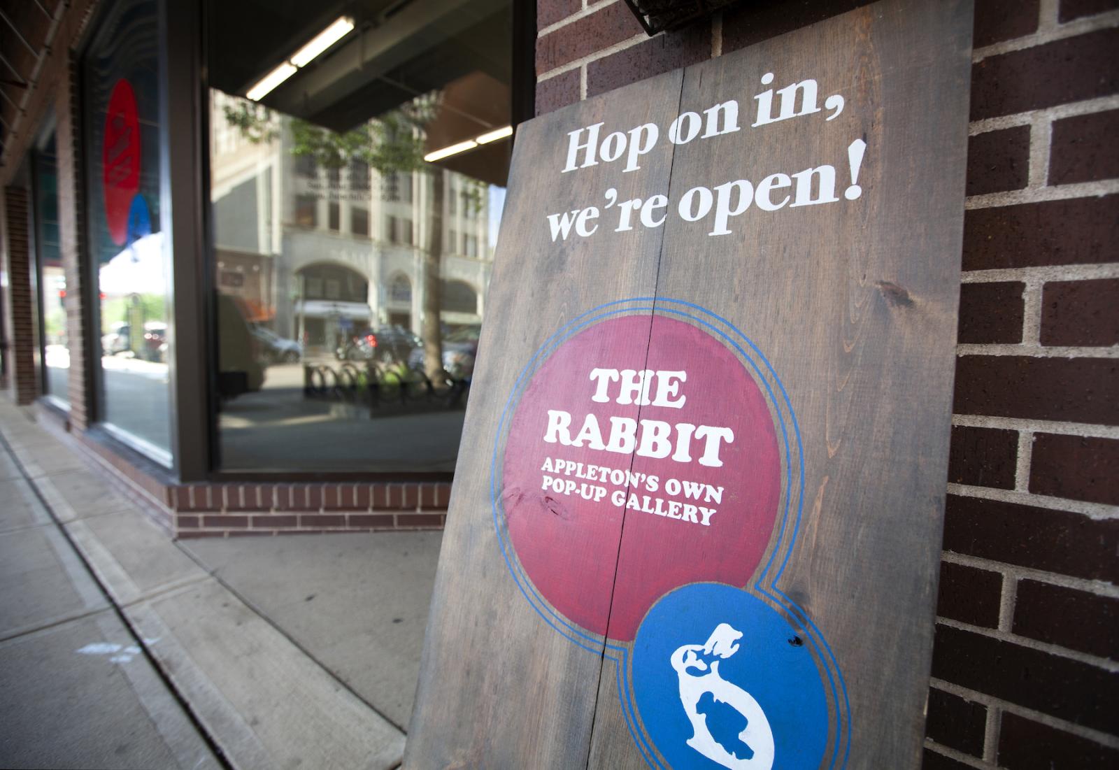 A sign welcomes visitors to the pop-up art gallery in City Center Plaza.
