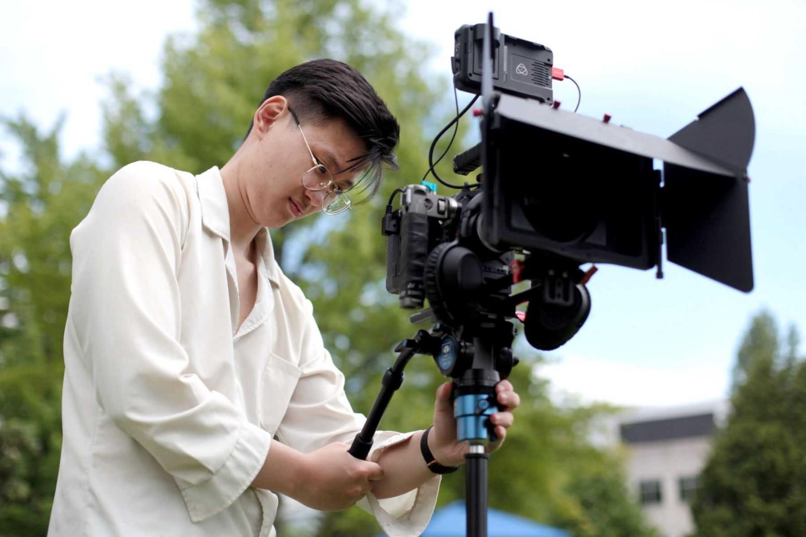 Luke Le works with a video camera during LUaroo in 2021.