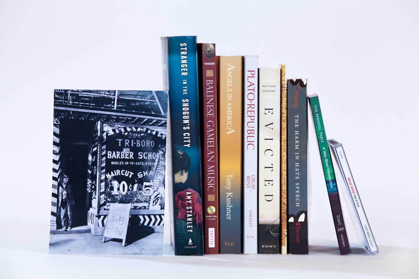 Photo of books and other First-Year Studies materials lined up on a shelf.