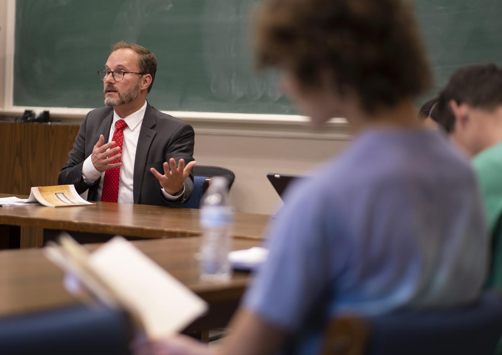 Professor Garth Bond talks about Natasha Tretheway's Native Guard during a First-Year Studies course in Main Hall. (Photo by Danny Damiani)