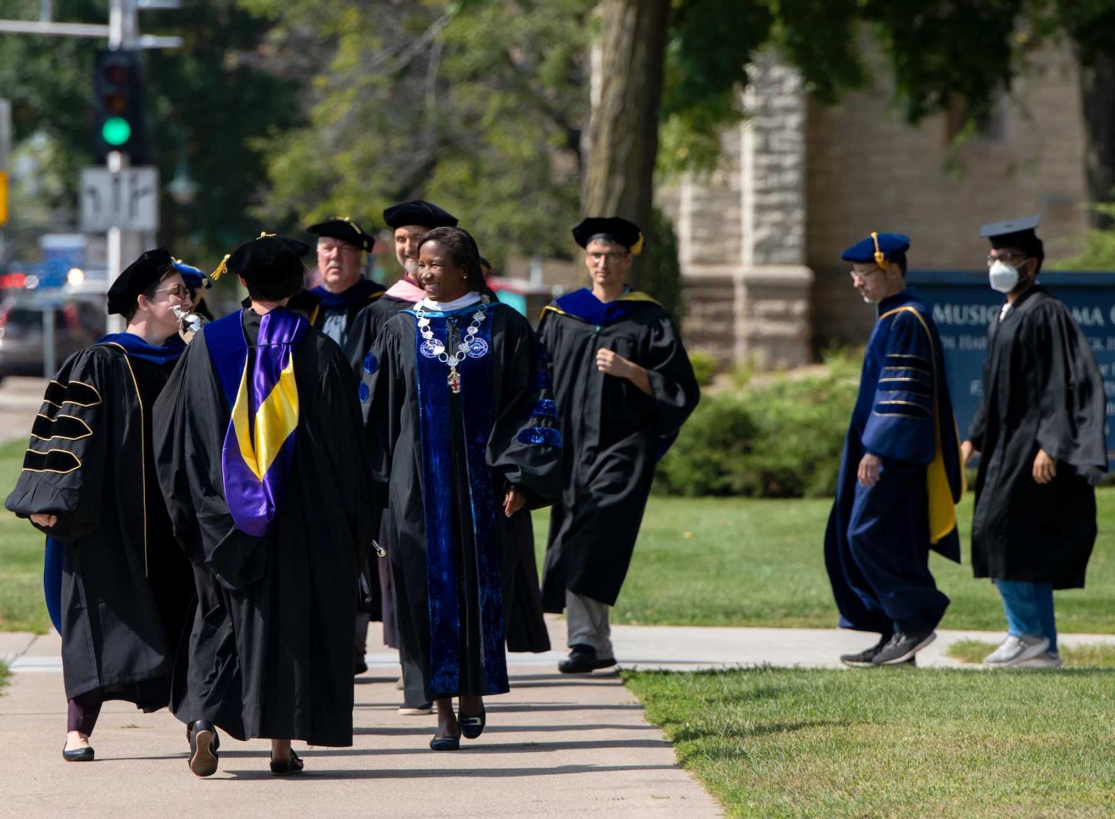 President Laurie Carter walks with faculty members at the front of the procession on the way into Memorial Chapel.