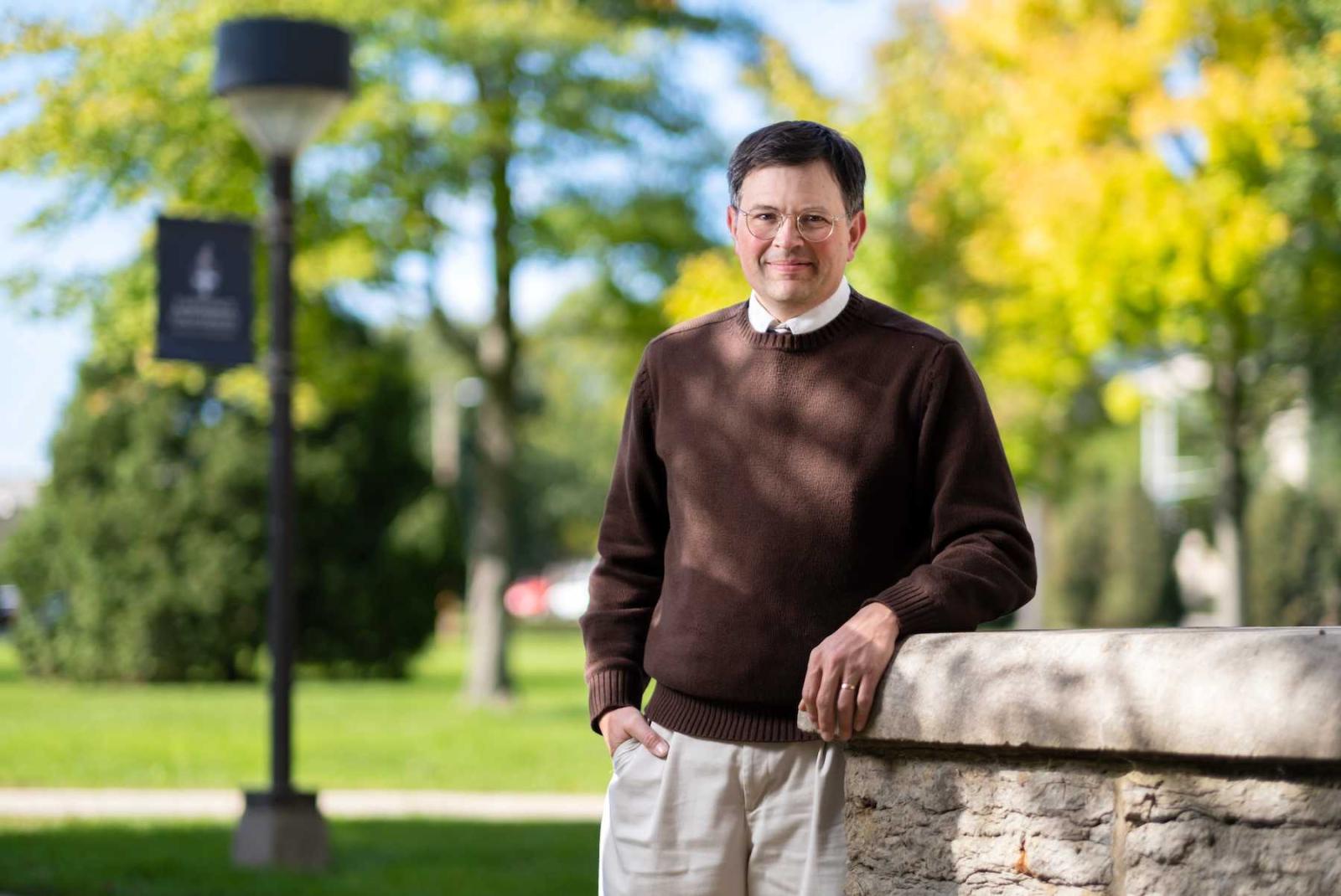 Arnold Shober poses for a photo on Main Hall Green. 