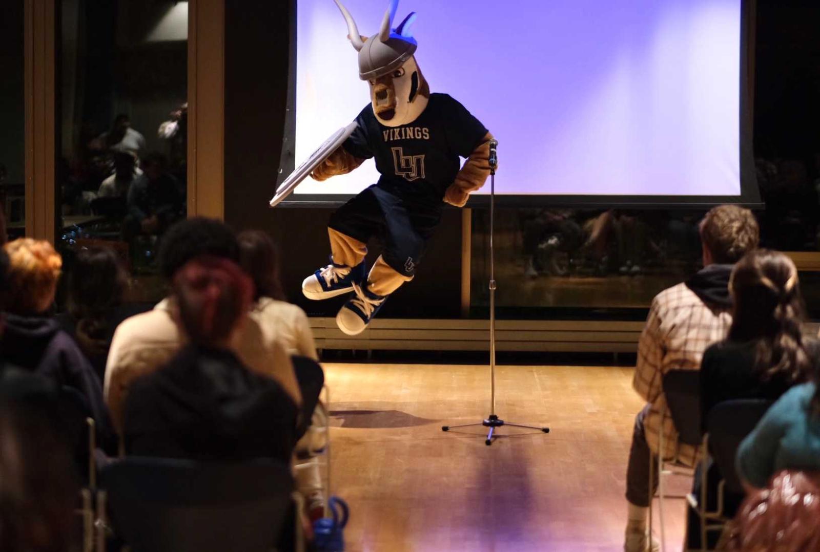 The antelope mascot performs on stage during the student talent show.