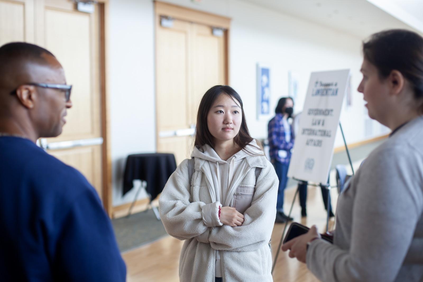 A student meets with alumni during a gathering in Warch Campus Center during Forever a Lawrentian weekend.