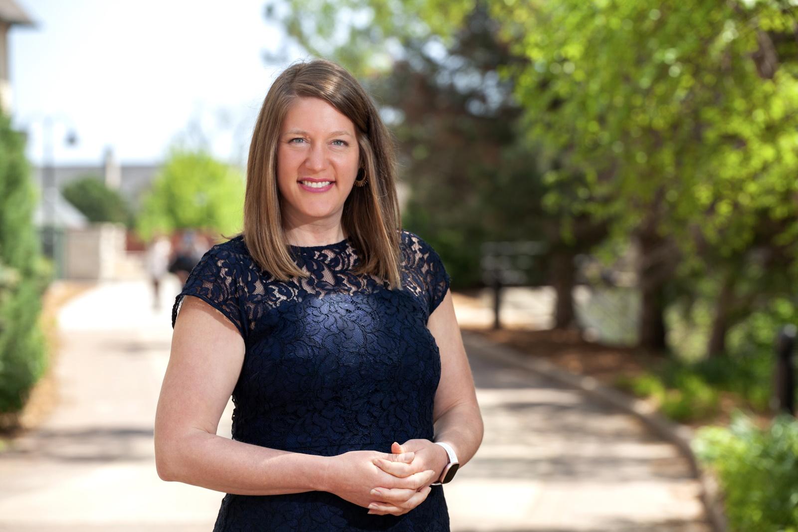 Elizabeth Becker poses for a photo outside of Briggs Hall.
