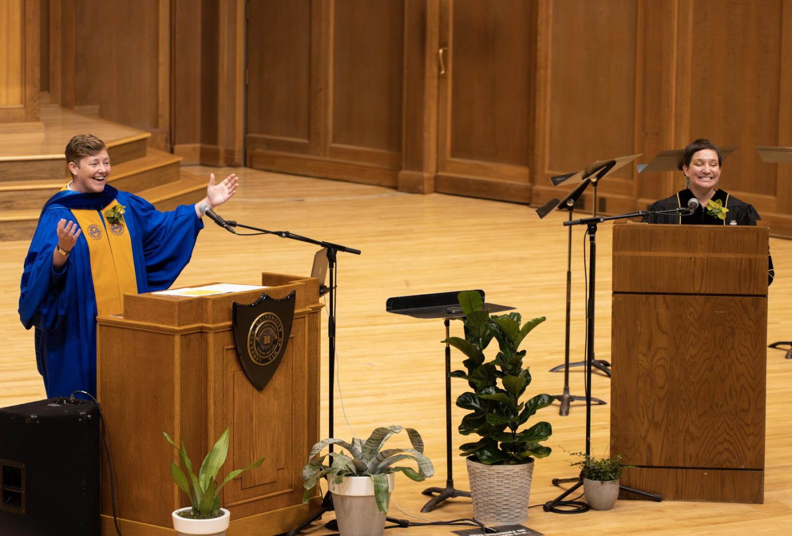 Constance Kassor, left, and Madera Allan share a laugh on stage at Memorial Chapel.