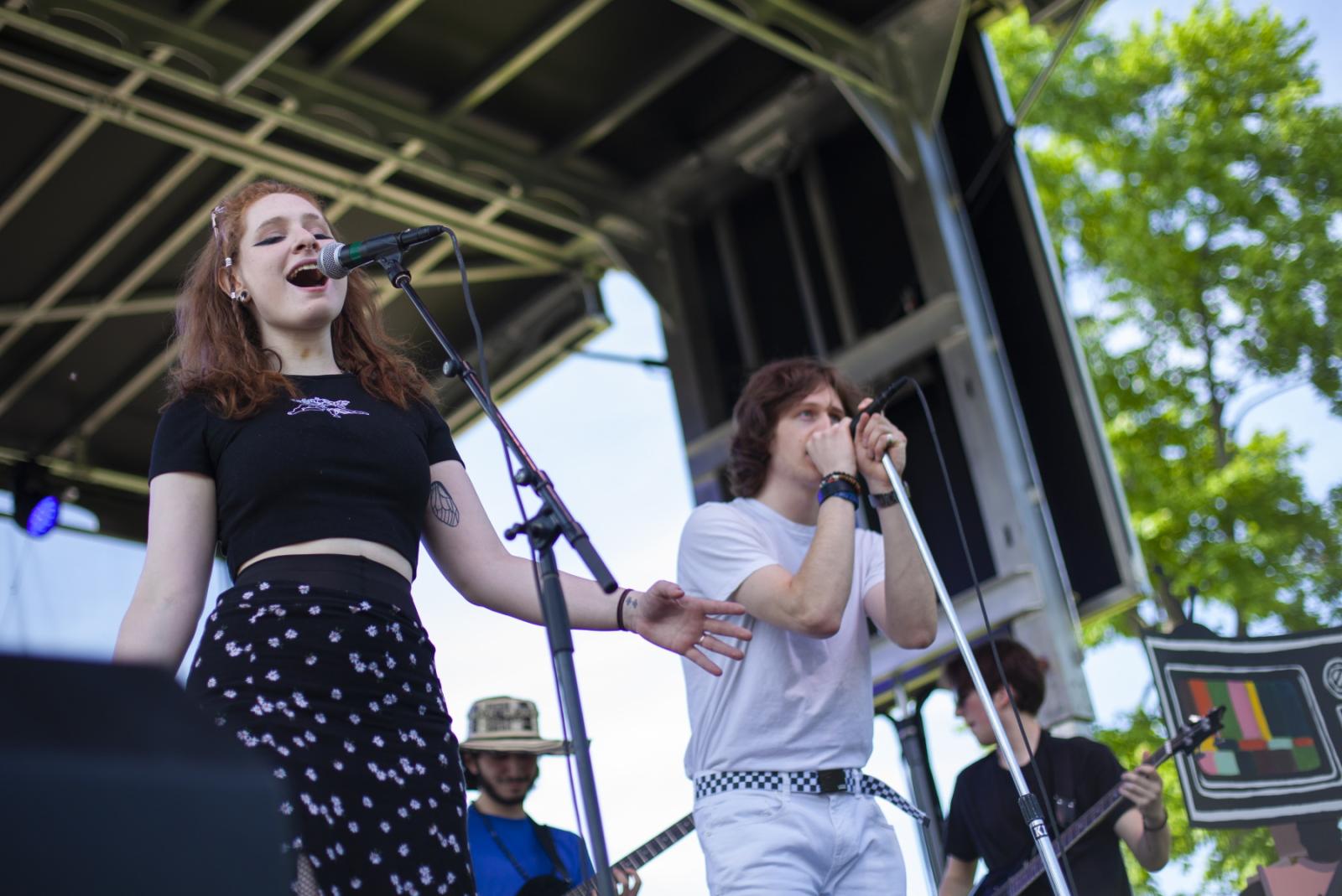The band Dirt Pile performs on stage on Main Hall Green.