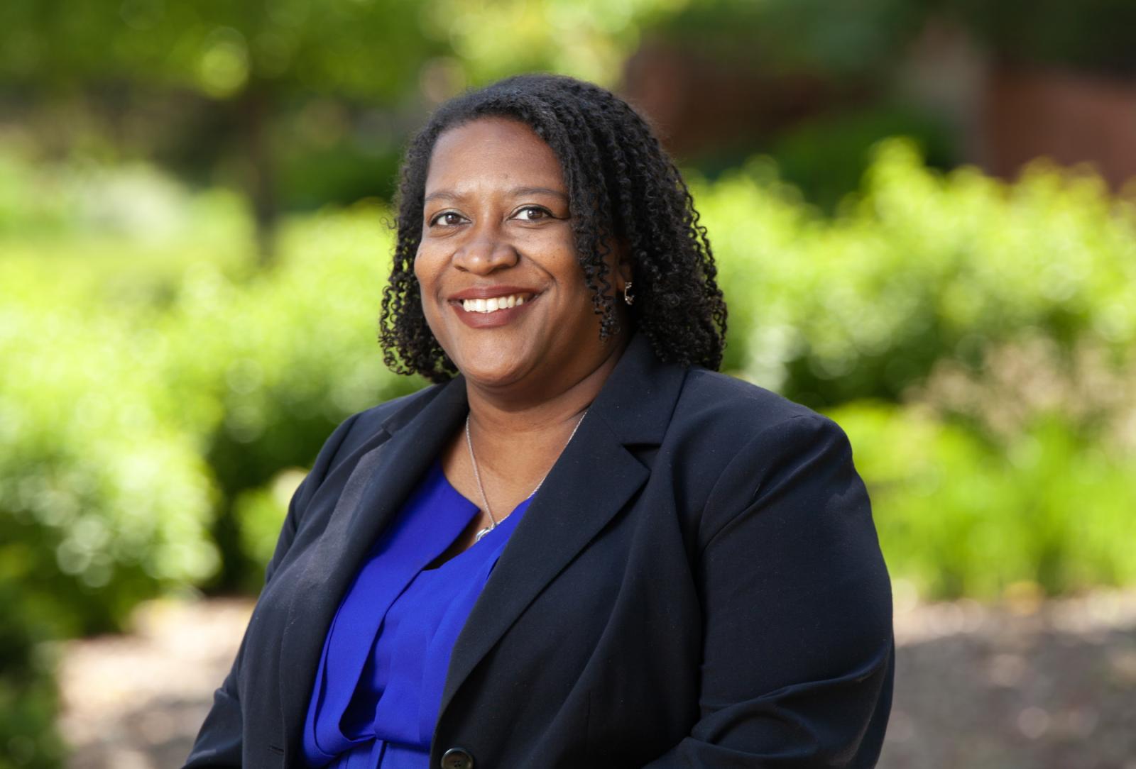 Terra Winston-Sage '00 poses for a portrait on campus.
