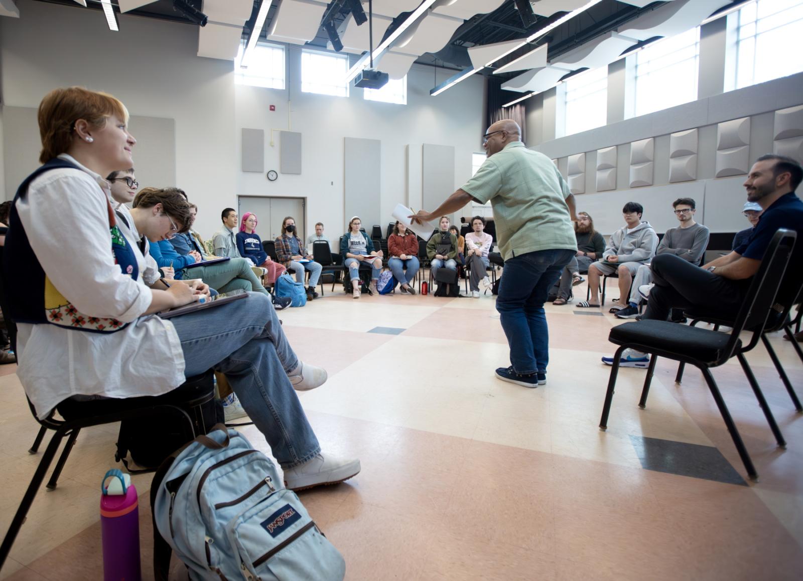 José Encarnación talks with students in Shattuck Hall as part of a How to Practice course.