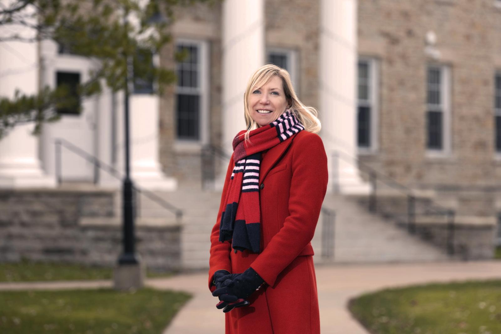 Judith Humphries poses for a portrait while standing in front of Main Hall.