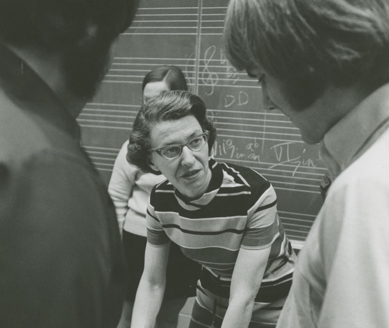 Marjory Irvin speaks with students in class in the early 1970s.