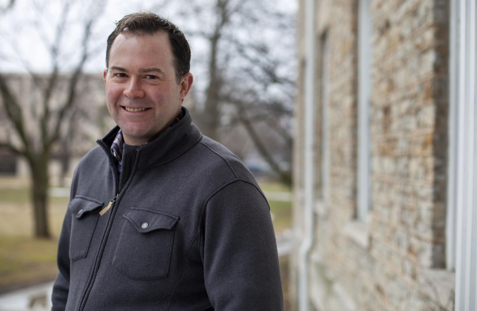 David McGlynn poses for a portrait on Main Hall Green.