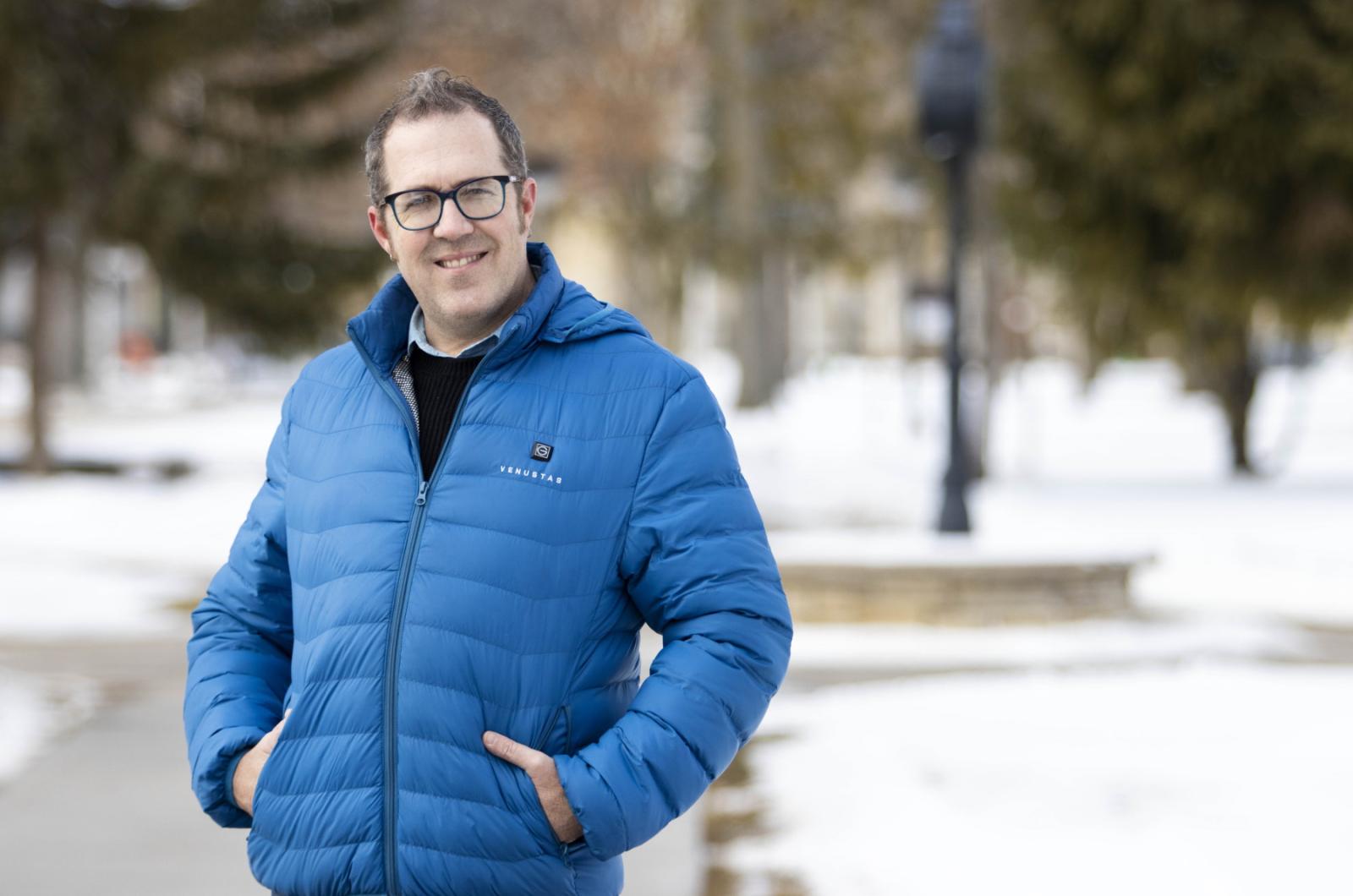 Benjamin Rinehart poses for a photo on Main Hall Green.