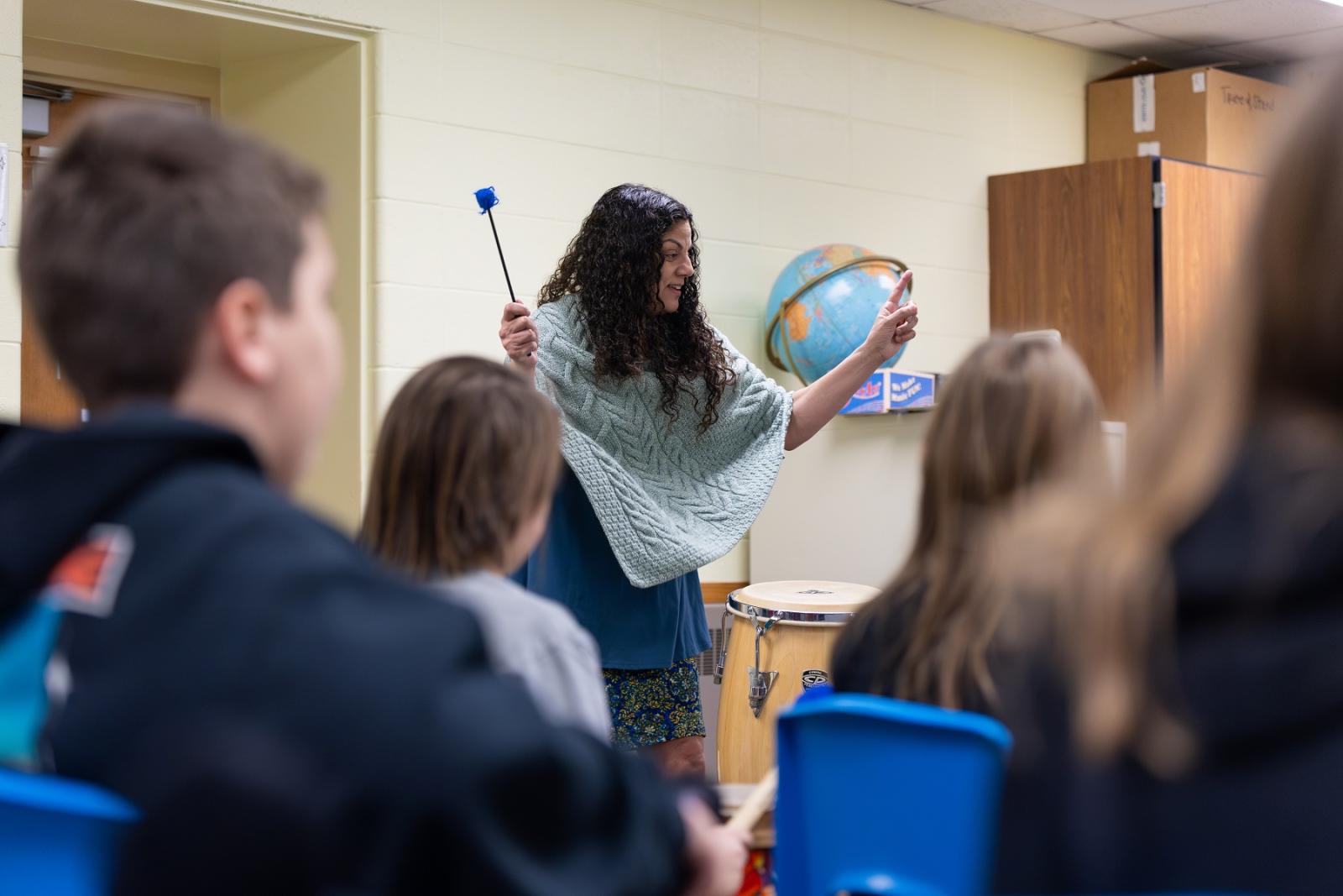 Leila Ramagopal Pertl leads students in song during a music class at Edison Elementary School in Appleton. 