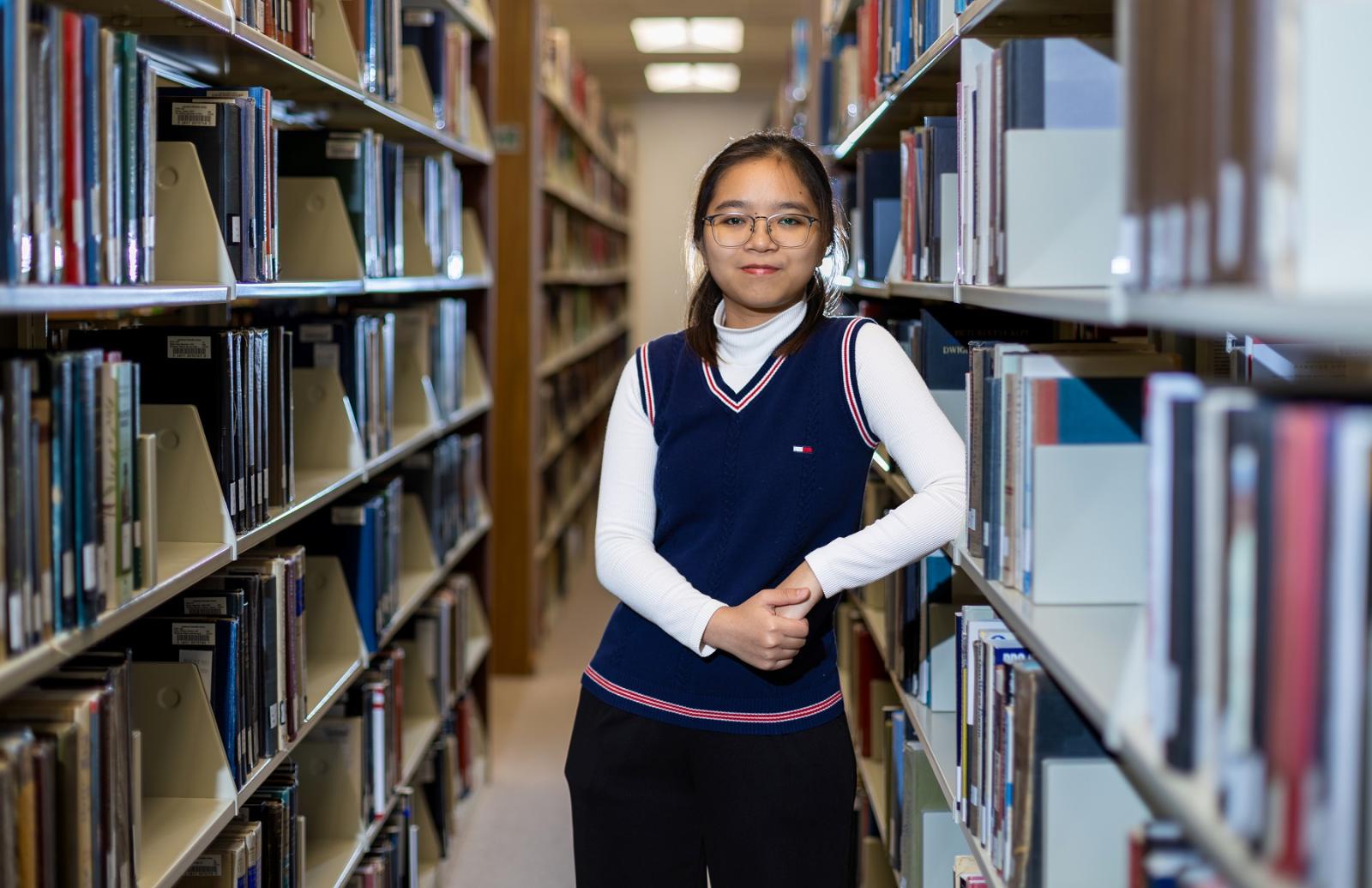 Cailey Cao Le poses for a portrait in Mudd Library.