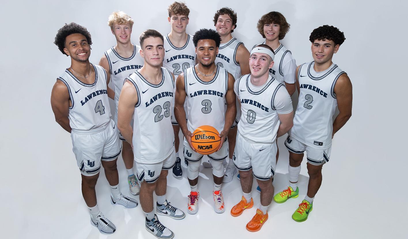 Men's basketball team poses for a team photo