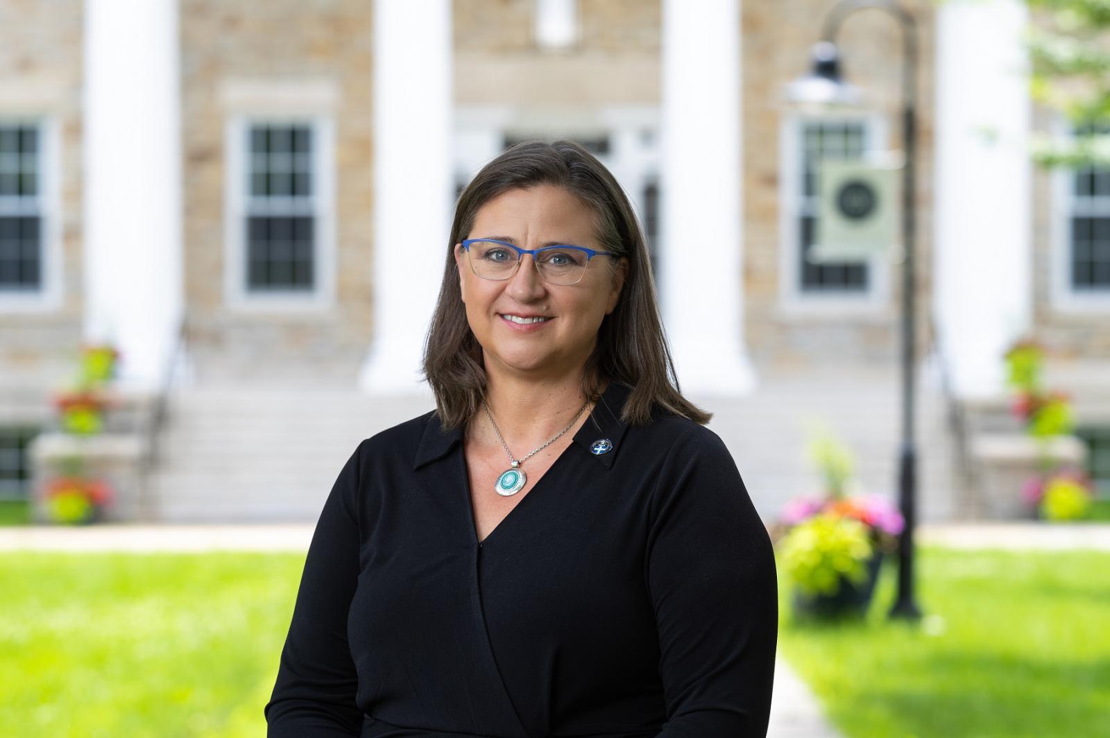 Teresa Schoffelman poses for a photo on Main Hall Green. 