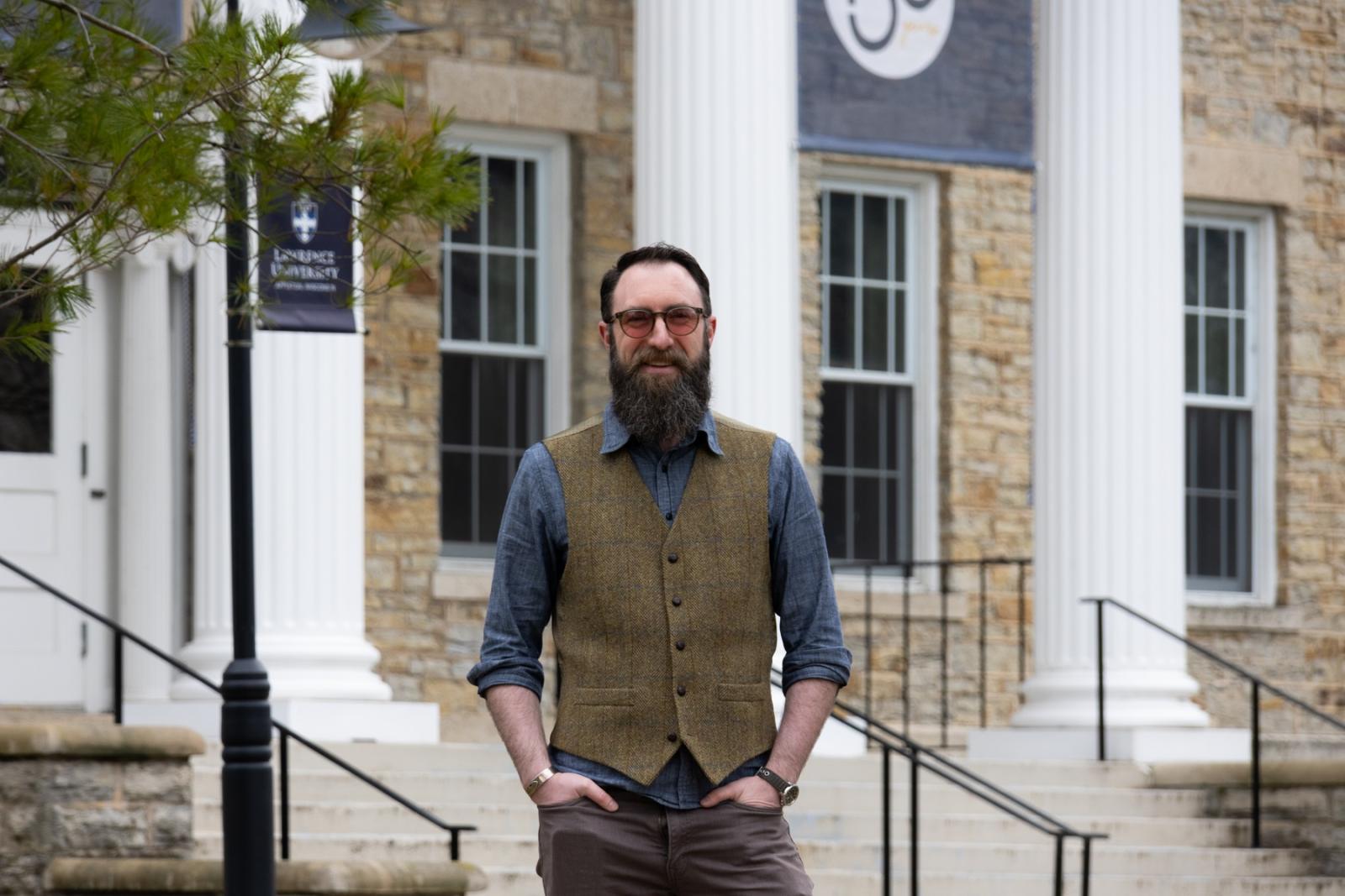 Kurt Wilson poses for a photo in front of Main Hall.