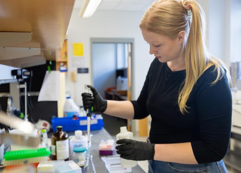 Lawrence University senior Charlie Bunch works in a science lab. 