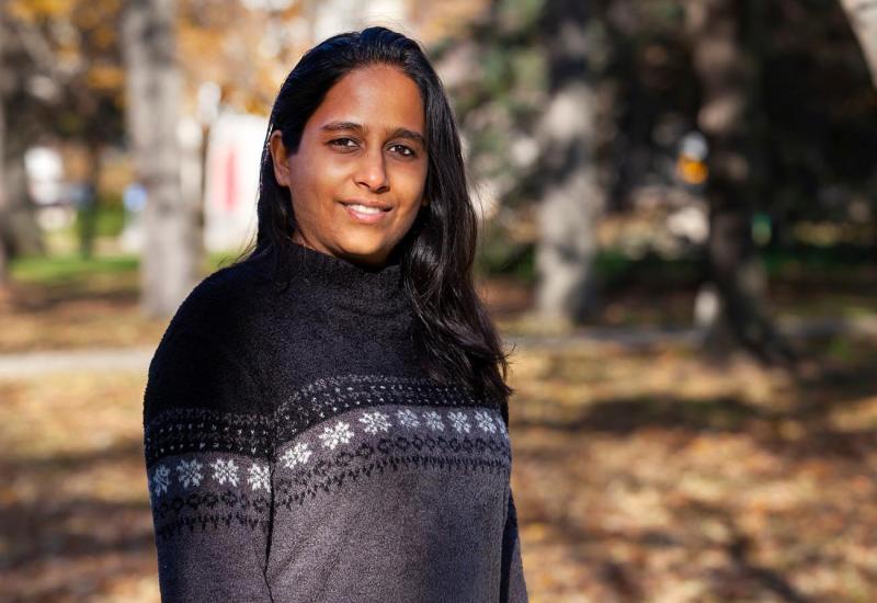 Asha Srinivasan, music composition faculty, poses on Lawrence Main Hall Green