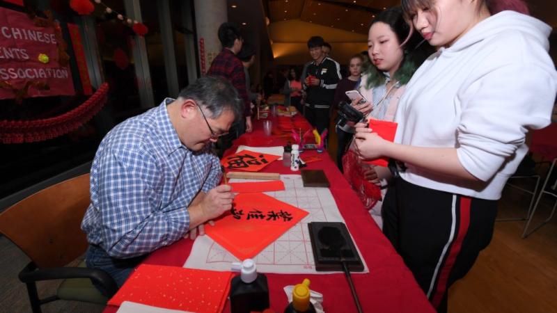 A table at last year's Lunar New Year draws visitors.