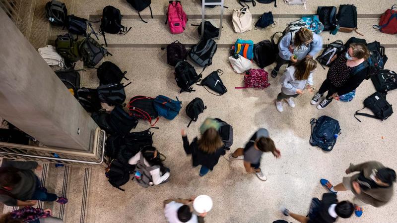 Students drop off and pick up their bags outside of Andrew Commons