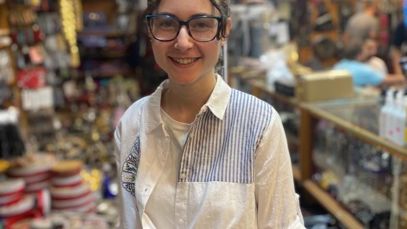 Sela Dombrower stands in a market in Amman, Jordan.