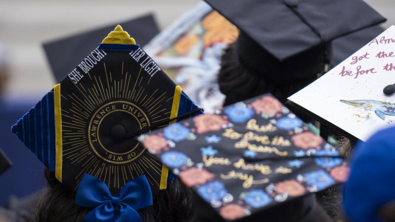 Close up of decorated graduation caps.