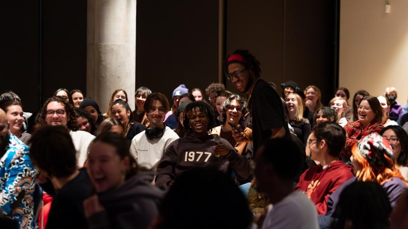Members of the audience interact.