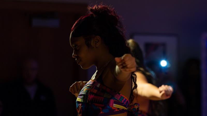 A dancer performs on stage.