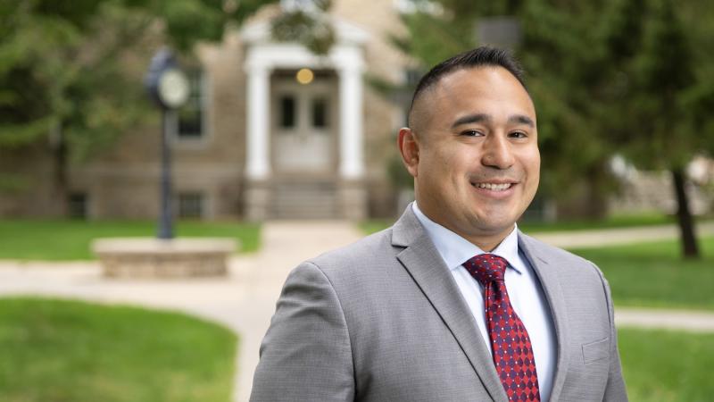 Juan Arguello poses for a portrait on Main Hall Green.