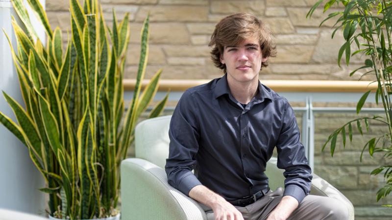 Joseph Carpenter poses for a photo in Steitz Hall of Science.