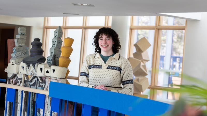Senior Maddy Tevonian poses for a photo in the Wriston Art Center.