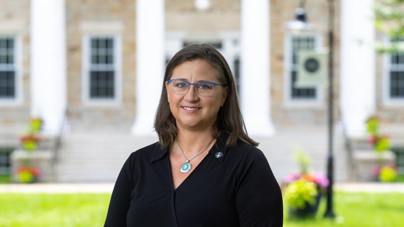 Teresa Schoffelman poses for a photo on Main Hall Green. 