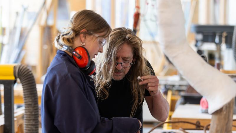 Ellie Kane, a senior studio art major, creates bike racks from scrap metal as part of summer research with Rob Neilson, Frederick R. Layton Professor of Studio Art and professor of art.
