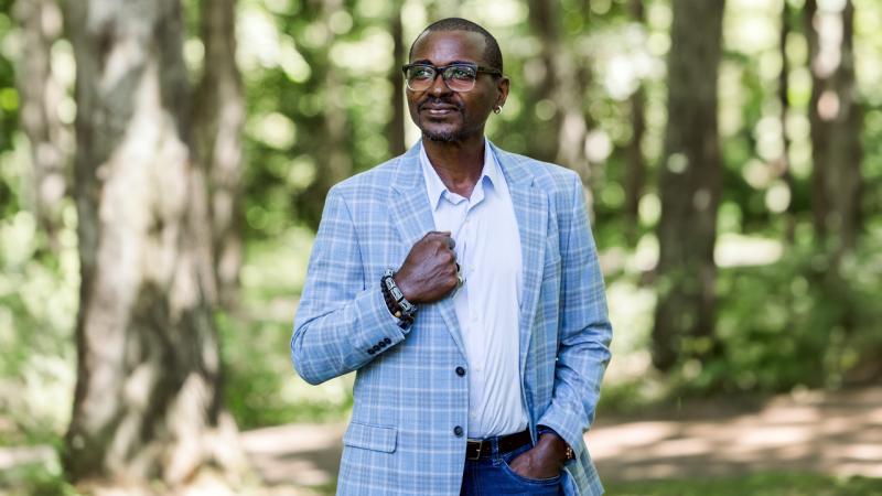 Robert Battle profile pic standing in a forest