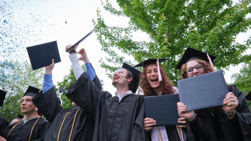 Confetti flies as Lawrence graduates cheer at the close of Commencement.