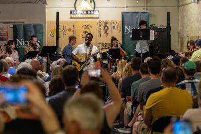 Ben Mulwana performs with students from the Lawrence Chamber Music Festival at Copper Rock Coffee Company.